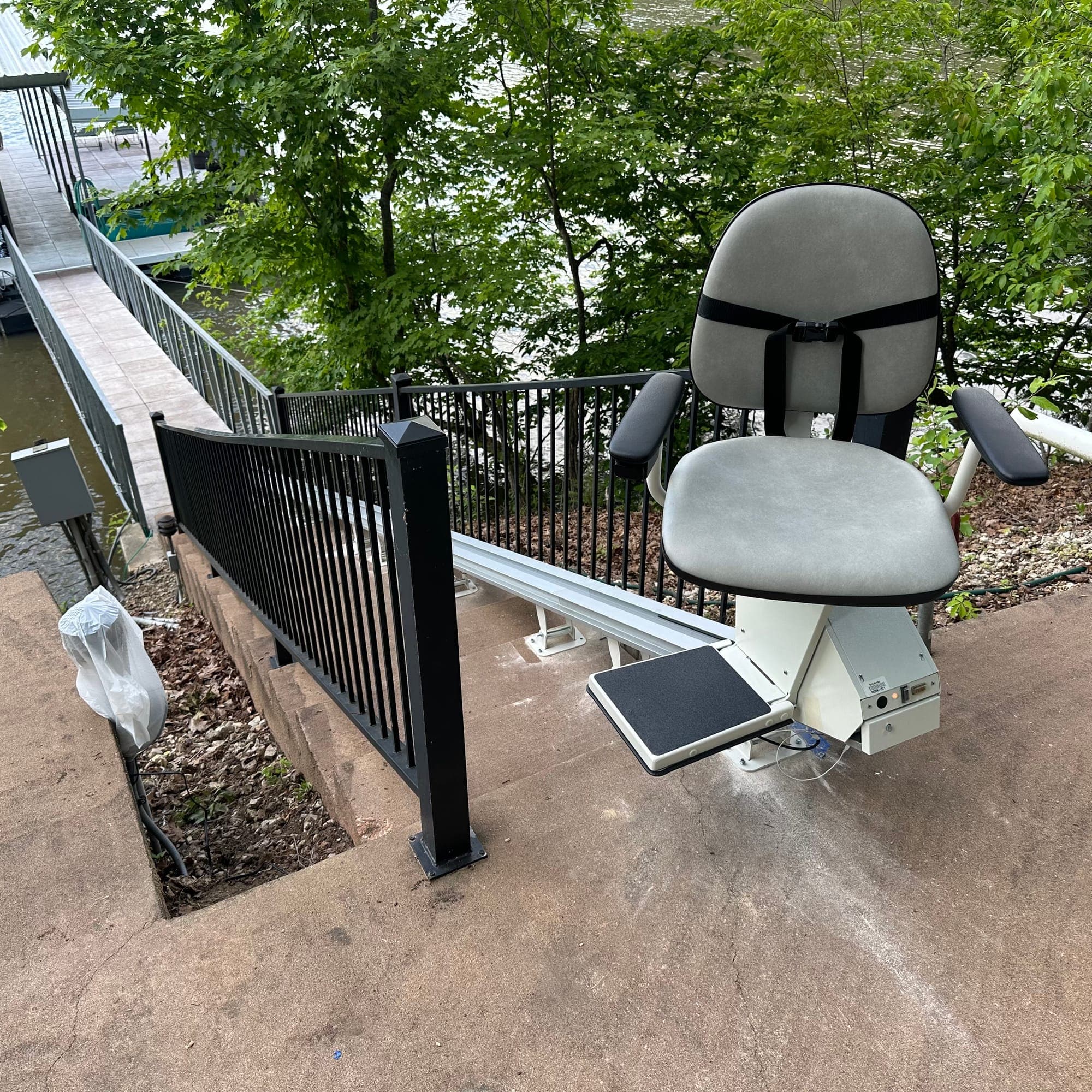 Outdoor stair chair installed along a lakeside walkway