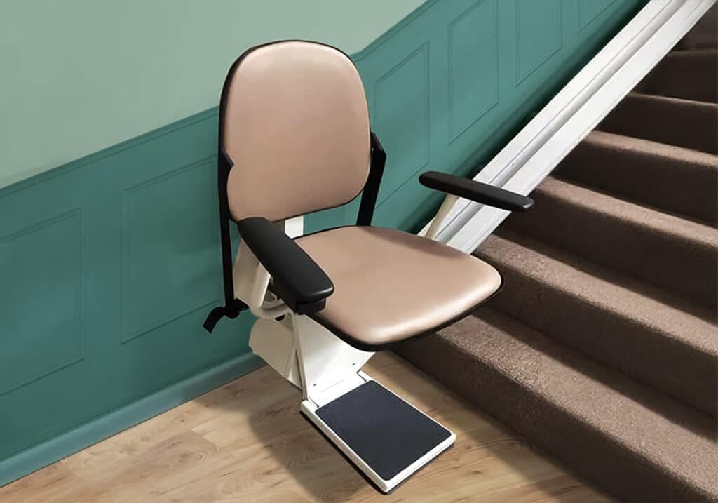 Stair chair on a straight staircase against a teal wall